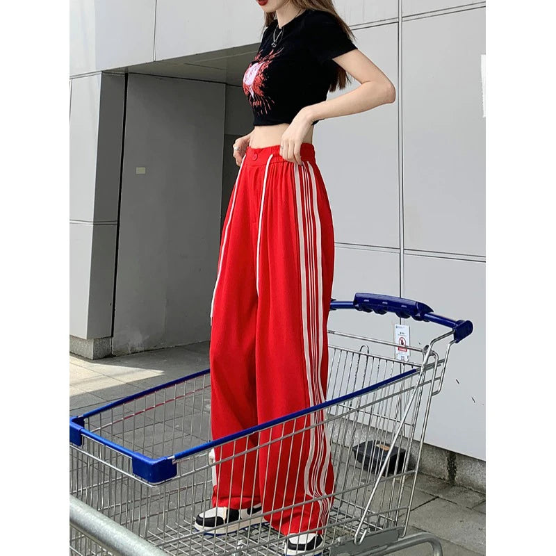Red track pants